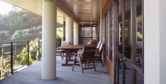 large covered deck with outdoor seating